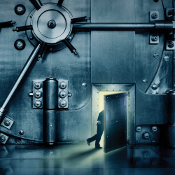 man surreptitiously enters a bank vault