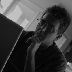 man watching laptop screen