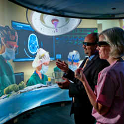 Amitabh Varshney (left) and Sarah Murthi at work in the University of Maryland’s Augmentarium.