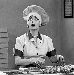 Lucy wearing chef's cap and working with chocolate