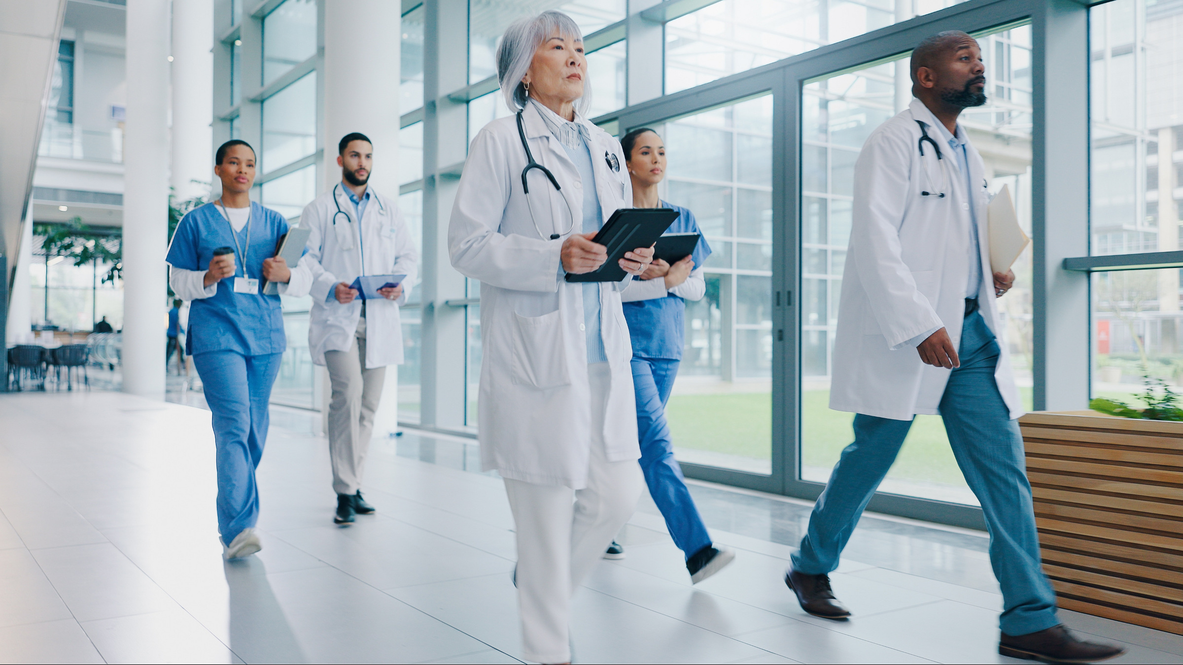 doctors and medical professionals walking in a hallway