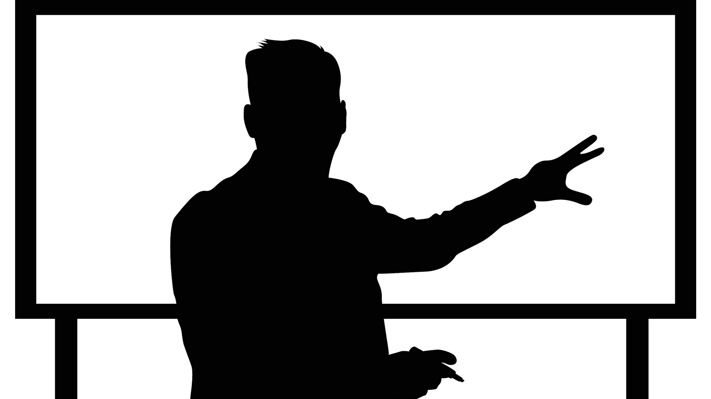 teacher at board in silhouette